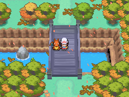 Dos personajes sobre un puente rodeado de árboles y agua en Pokémon Rose Gold NDS